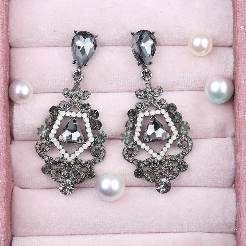 Pendientes de esqueleto de aleación de zinc de dhinestona al por mayor